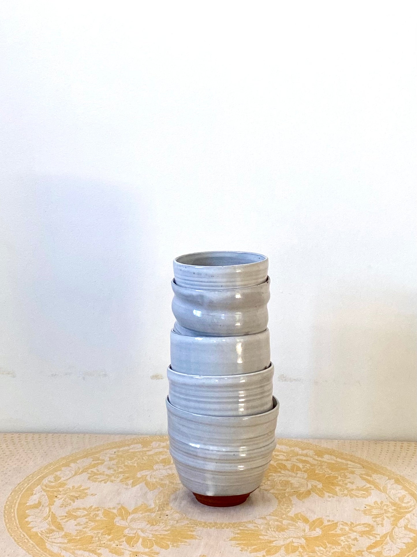 Set of terracotta and white vessels