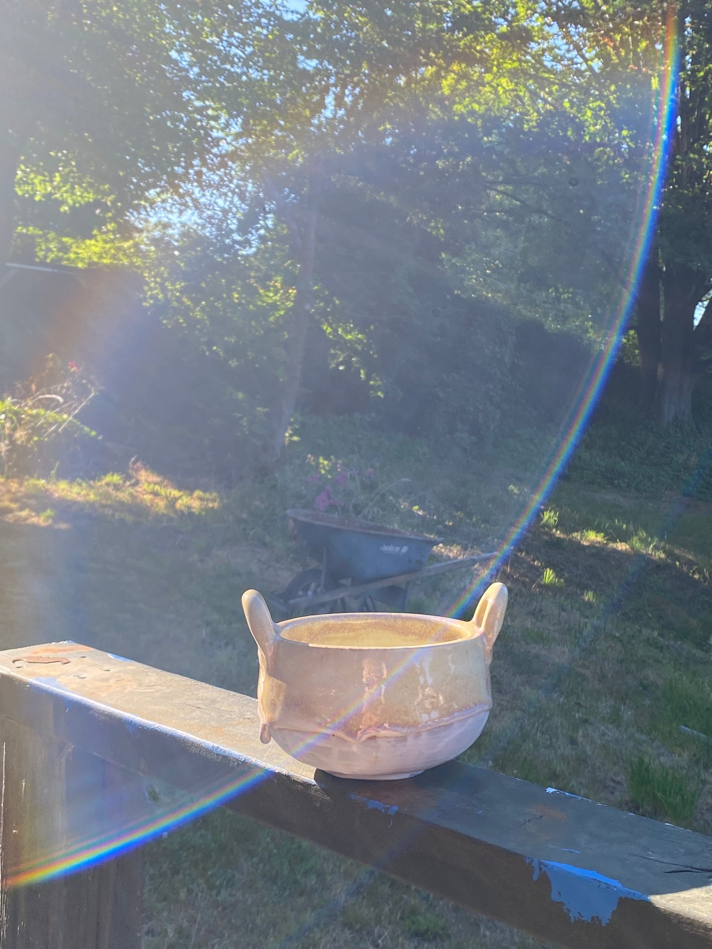 Small cream colored bowl with violet drips