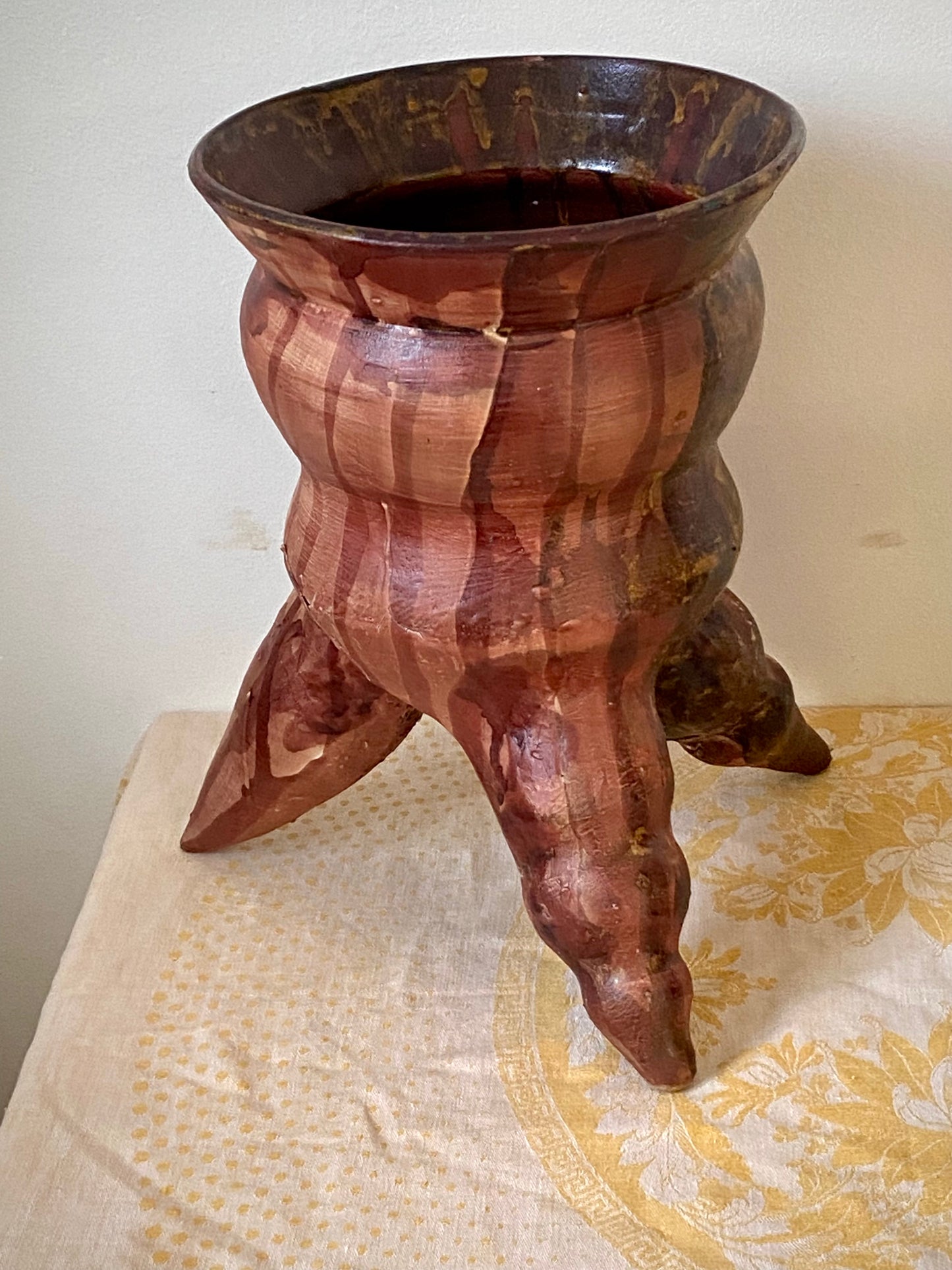 Tripod reddish pot