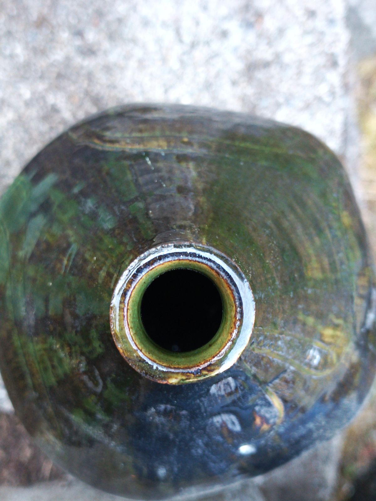 Dark green metallic tripod jug