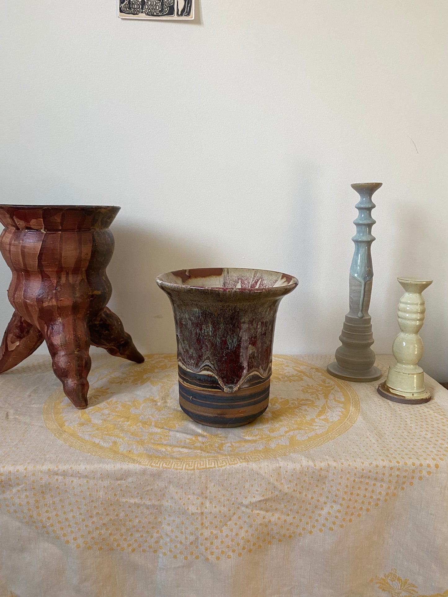 Tripod reddish pot