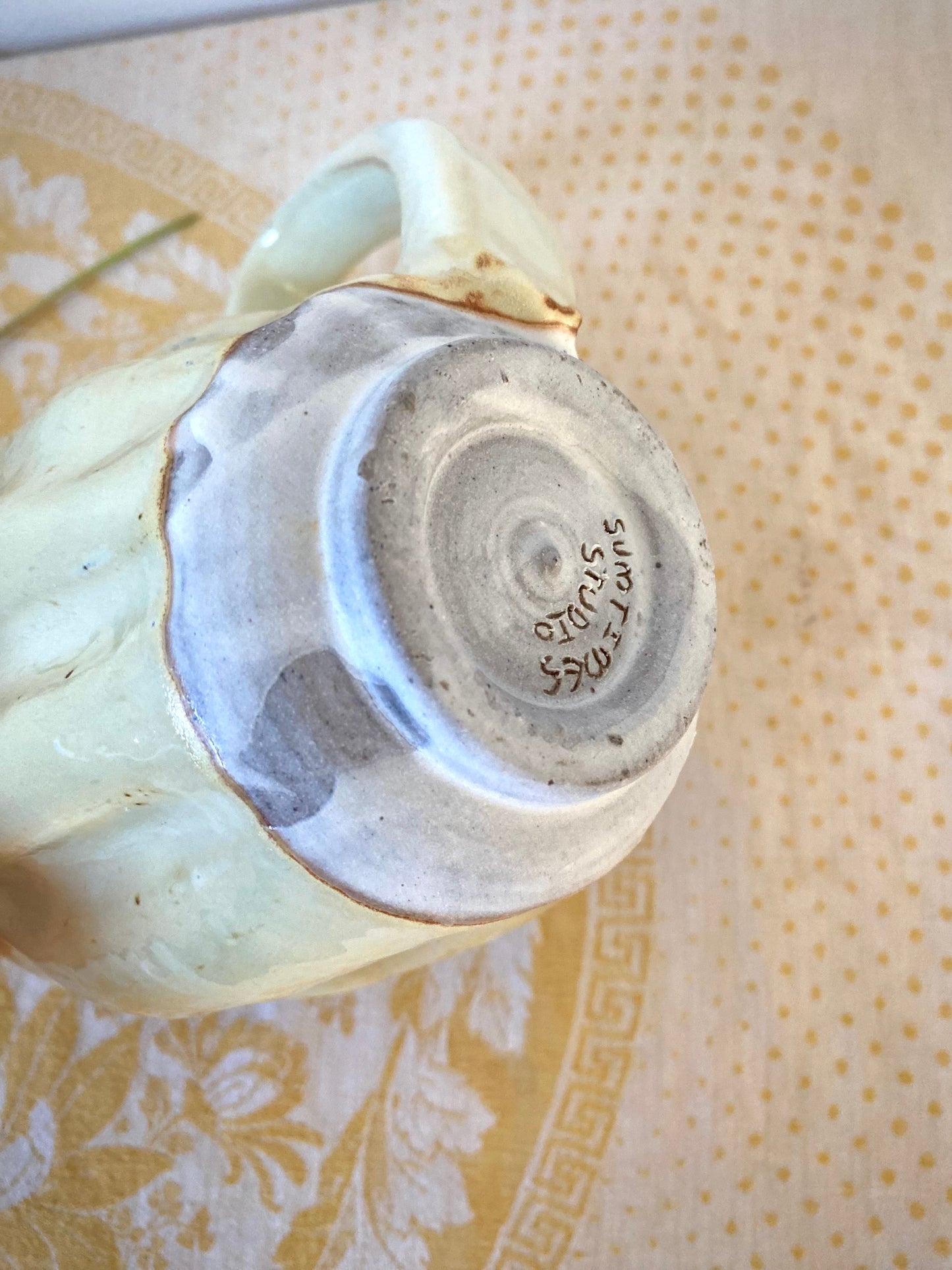 Cream colored mug with big ol’ handle
