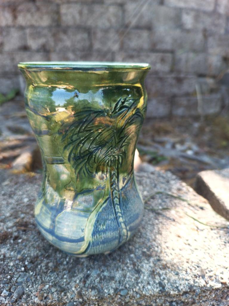 Green vase with blue carving & palm tree