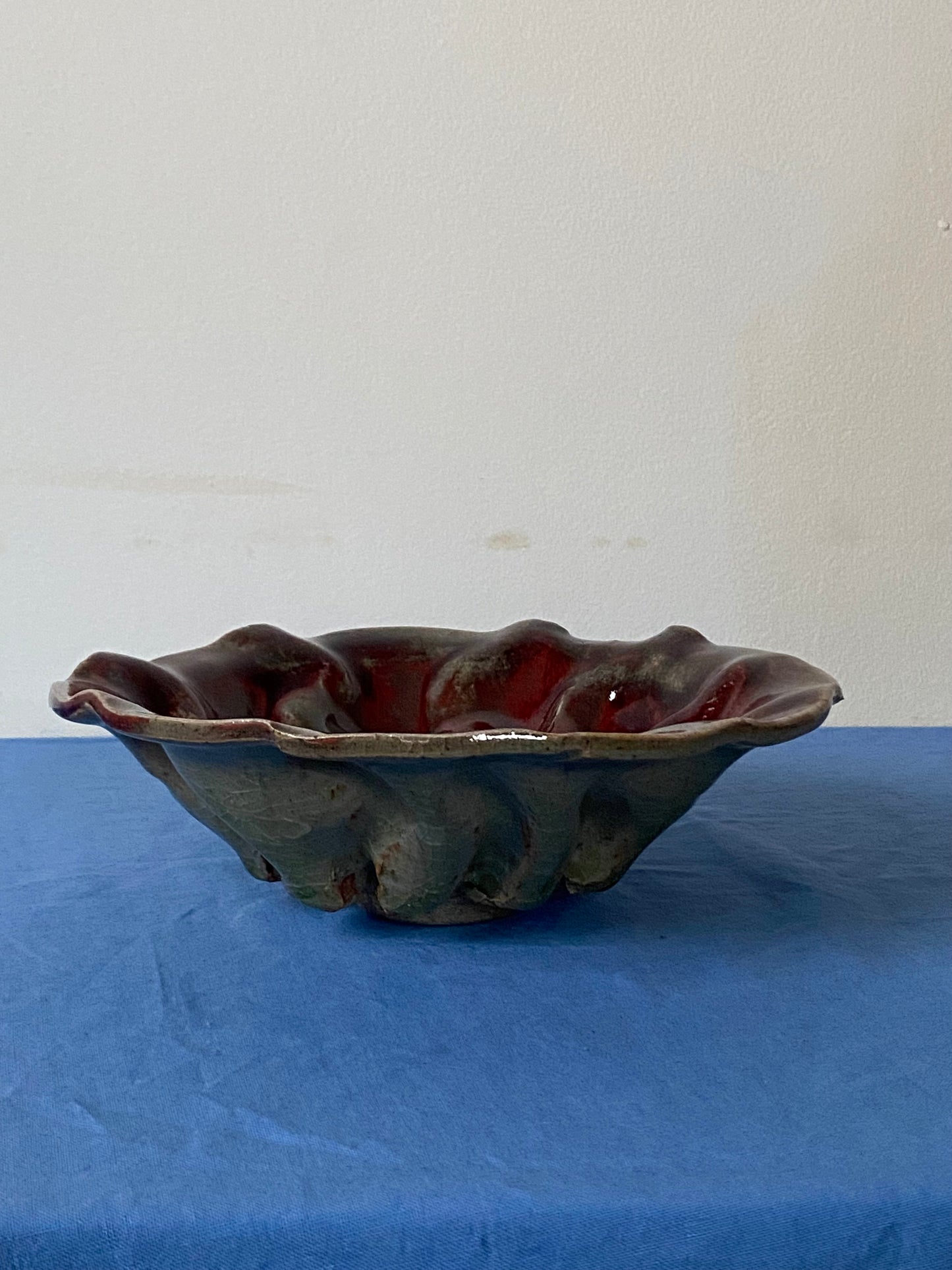 Ruffled bowl with red interior