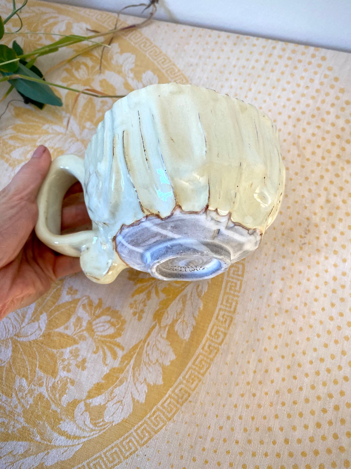 Cream colored mug with squared shape