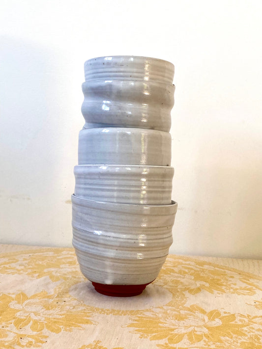 Set of terracotta and white vessels