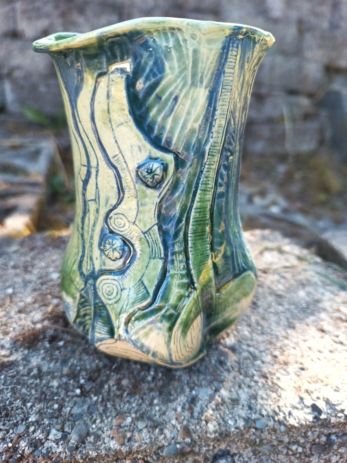 Green vase with blue carving