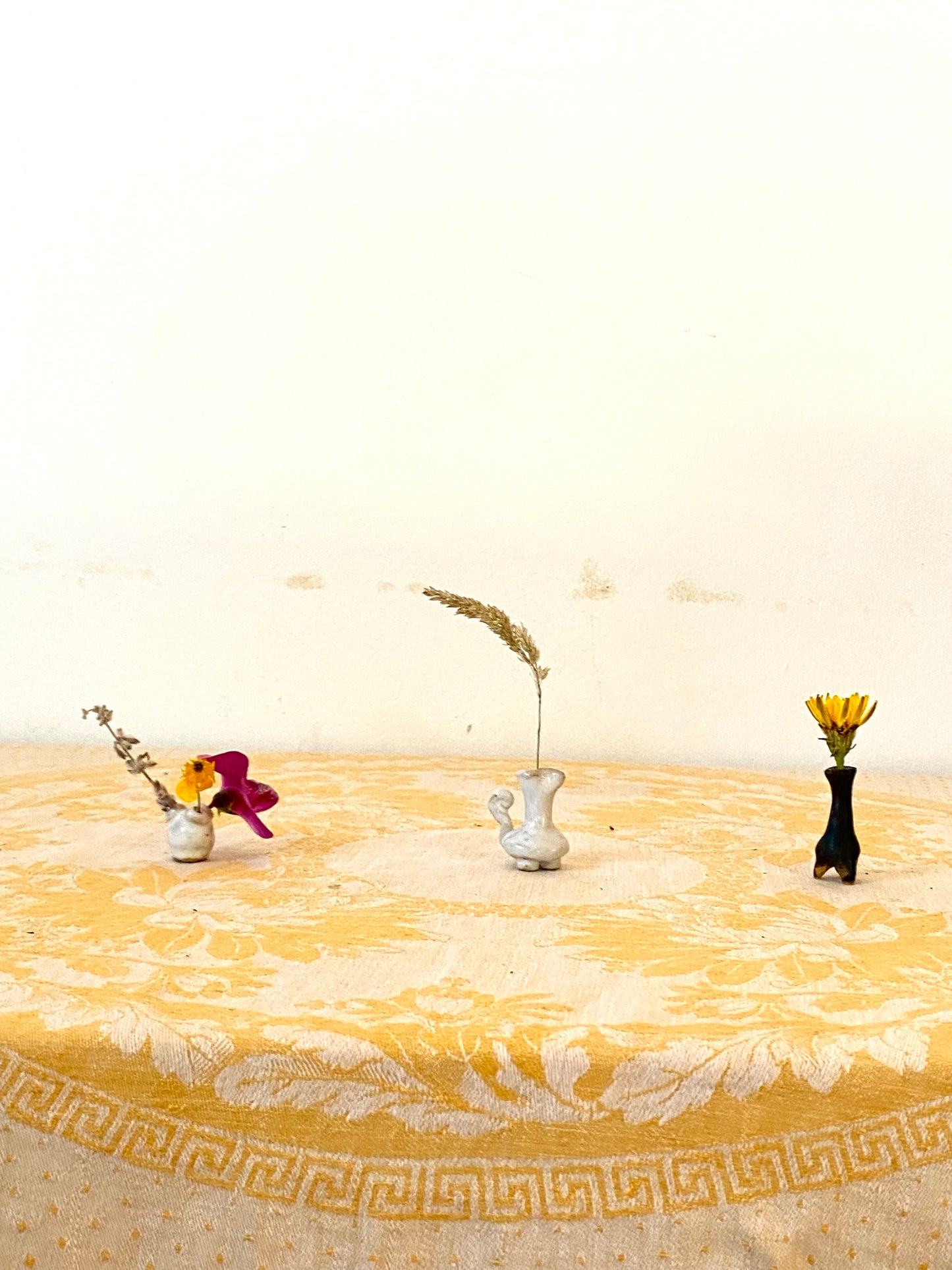 Very small vase with three apertures