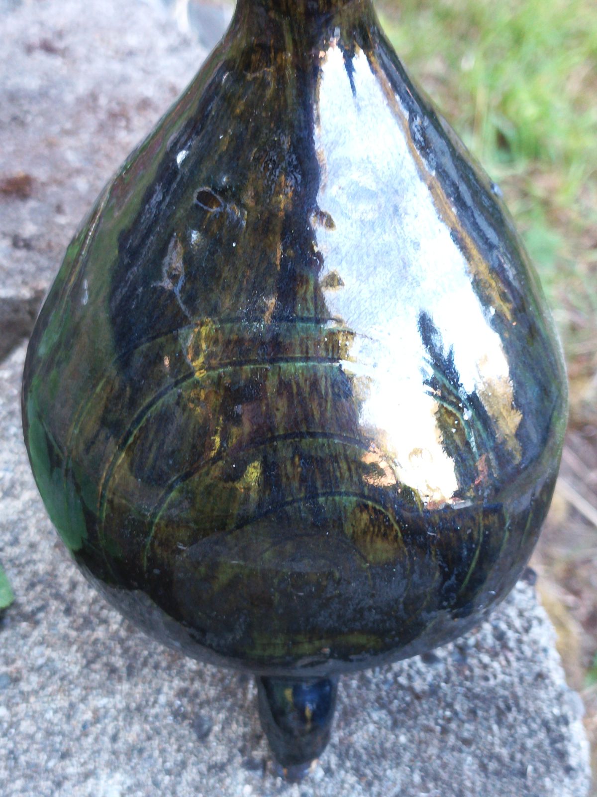 Dark green metallic tripod jug