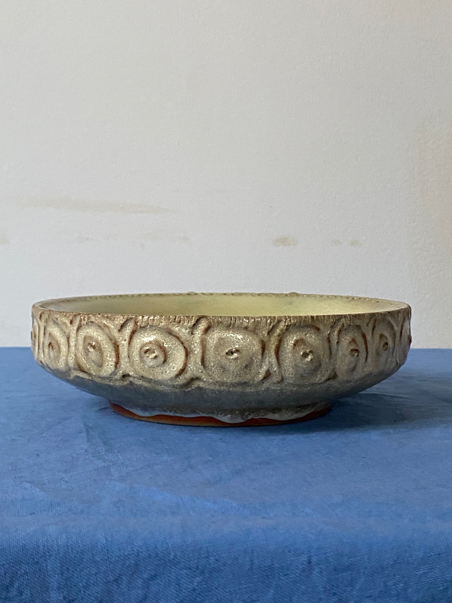 Shallow bowl with hollow wall, green interior