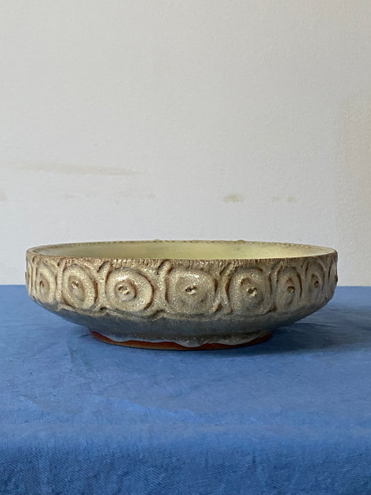 Shallow bowl with hollow wall, green interior