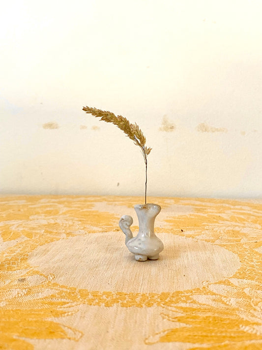 Very small vase with handle