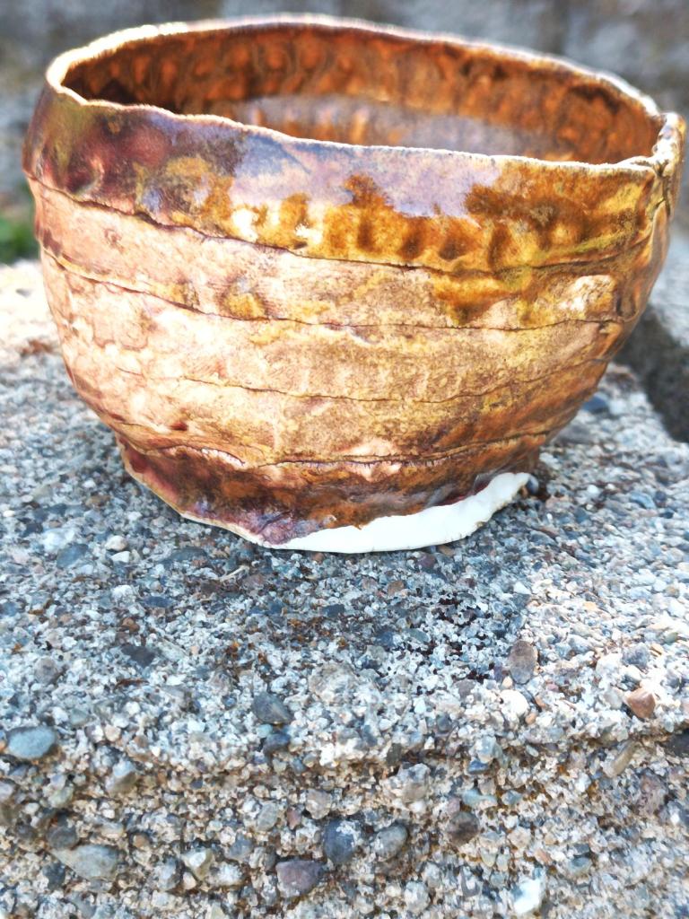 Handbuilt amber/mauve porcelain cup