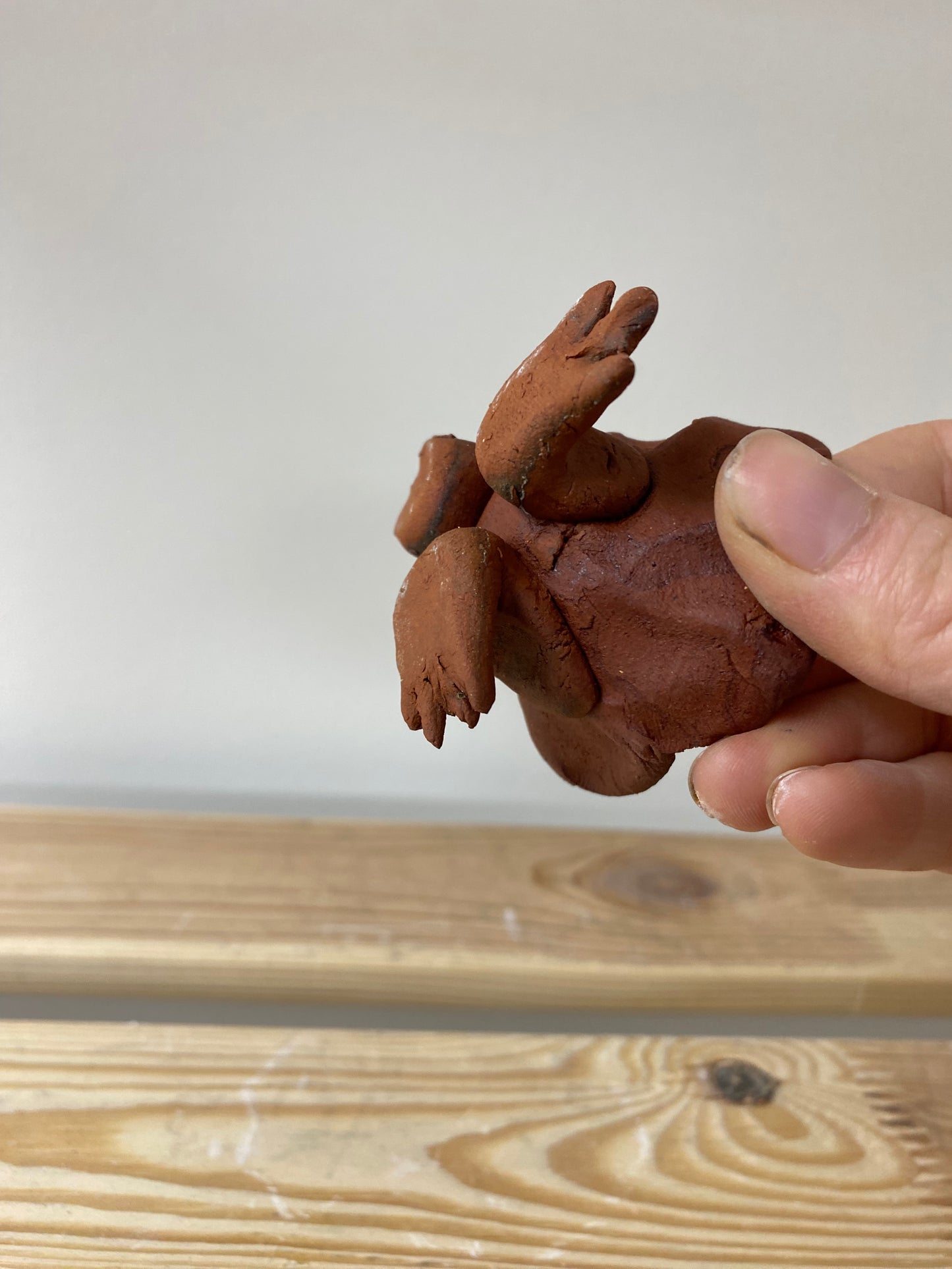 Smol terracotta candlestick with feet