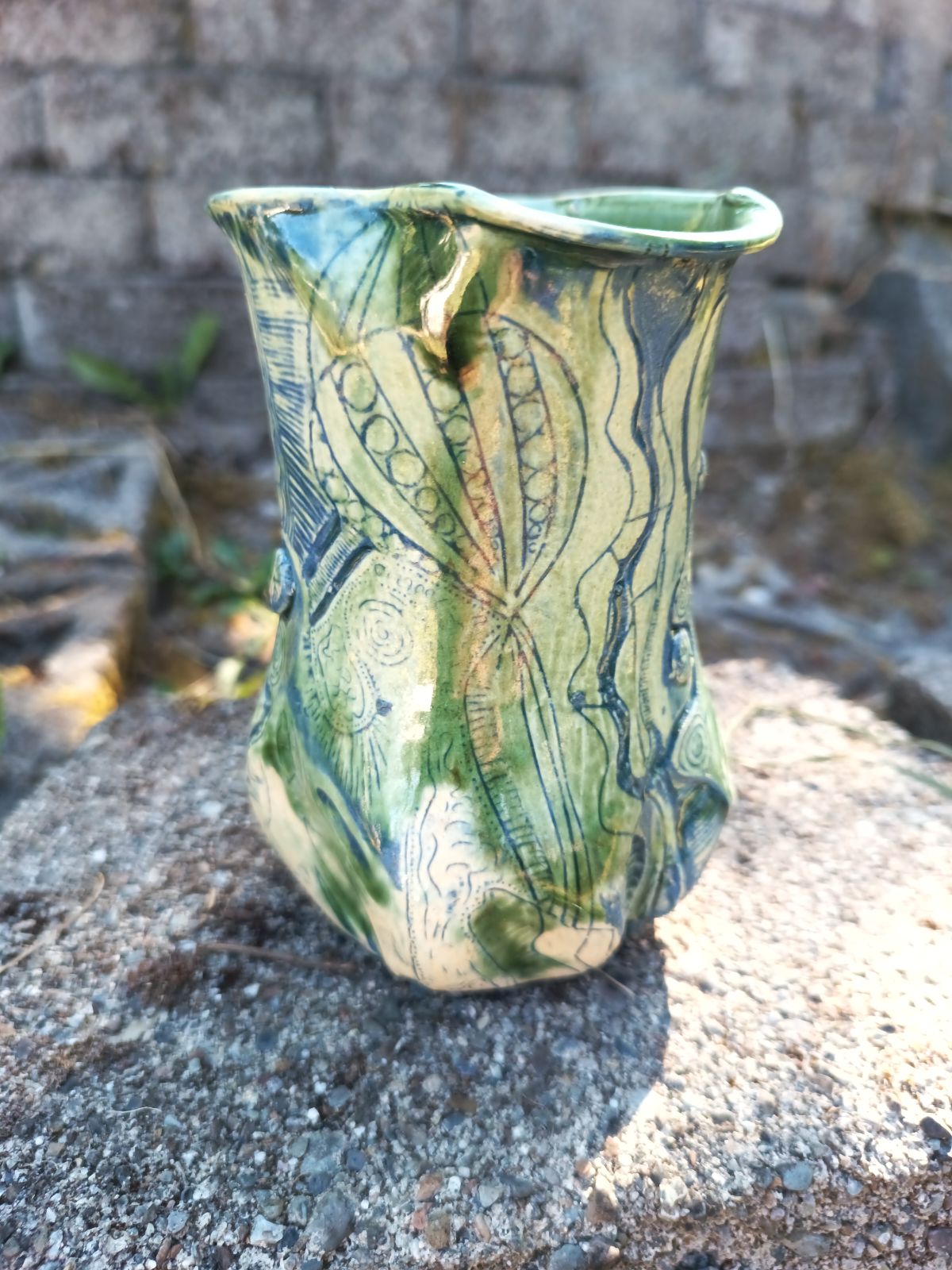 Green vase with blue carving