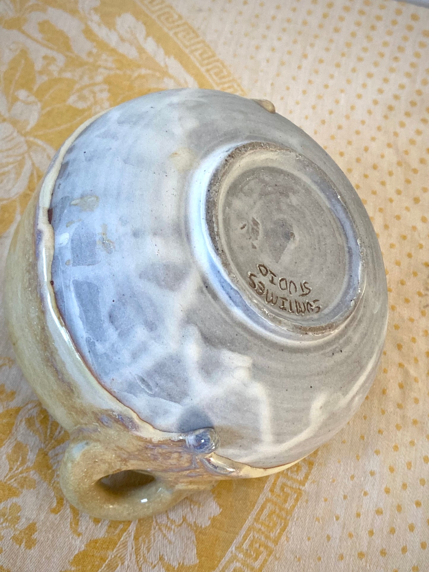 Small cream colored bowl with violet drips