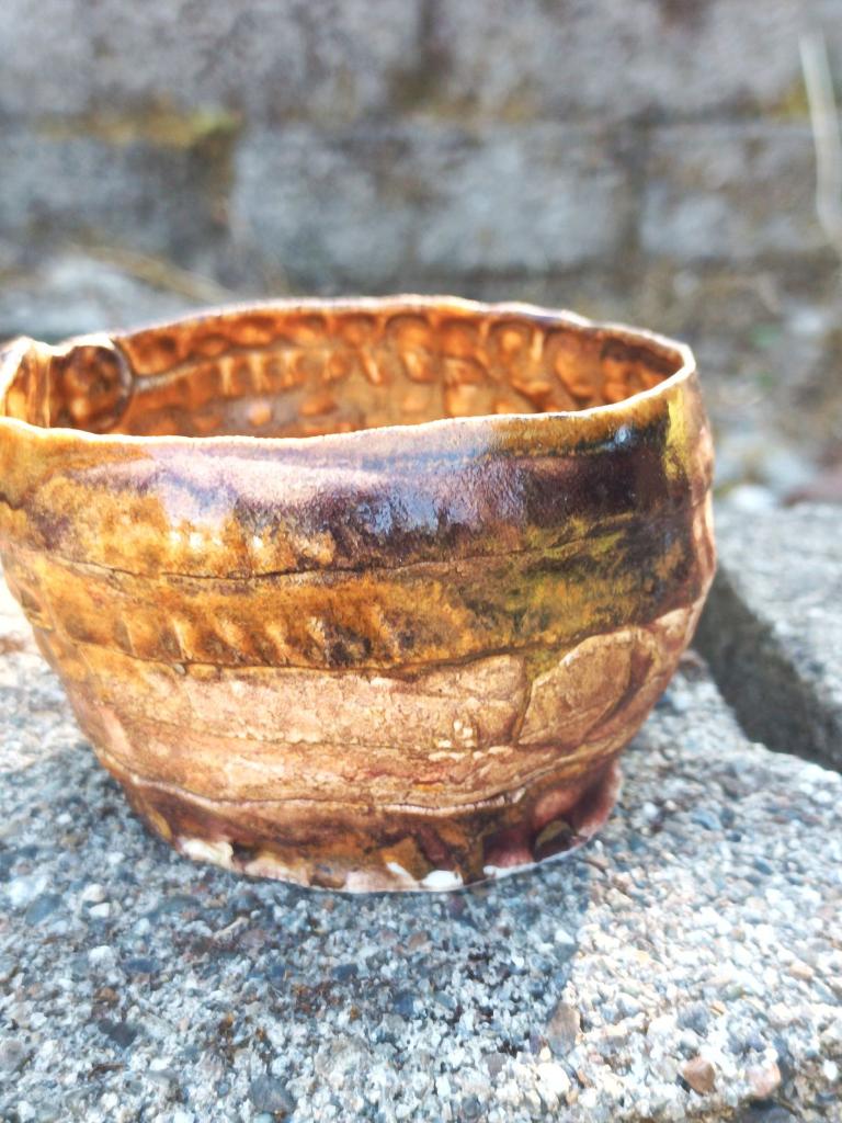 Handbuilt amber/mauve porcelain cup