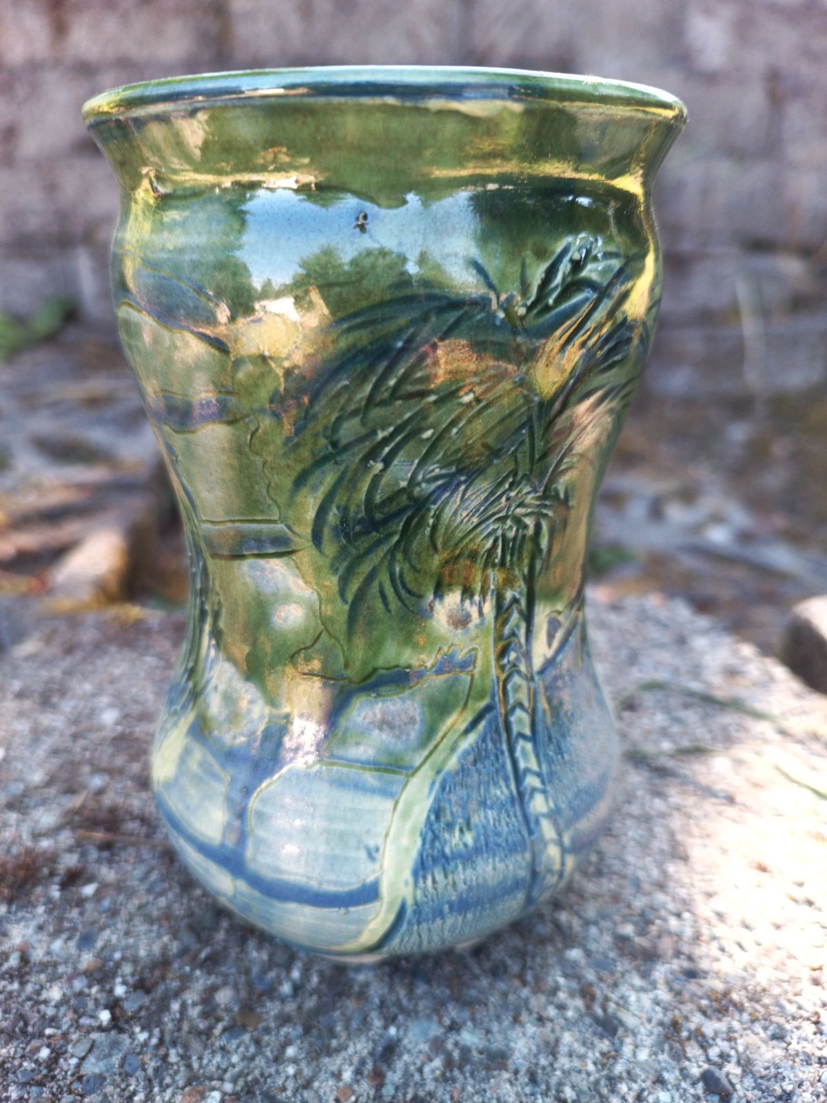 Green vase with blue carving & palm tree