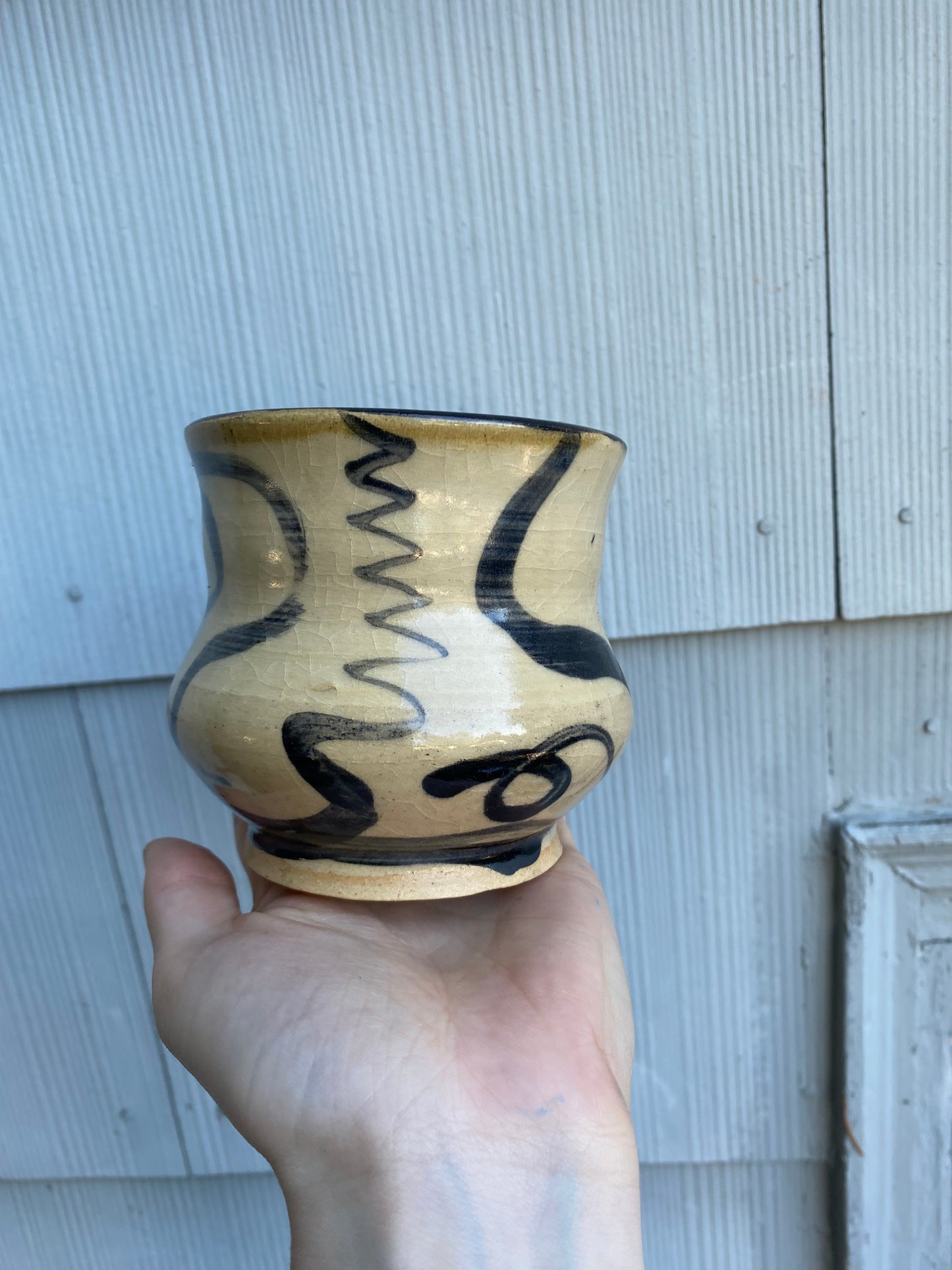 Beige cup with zigzag