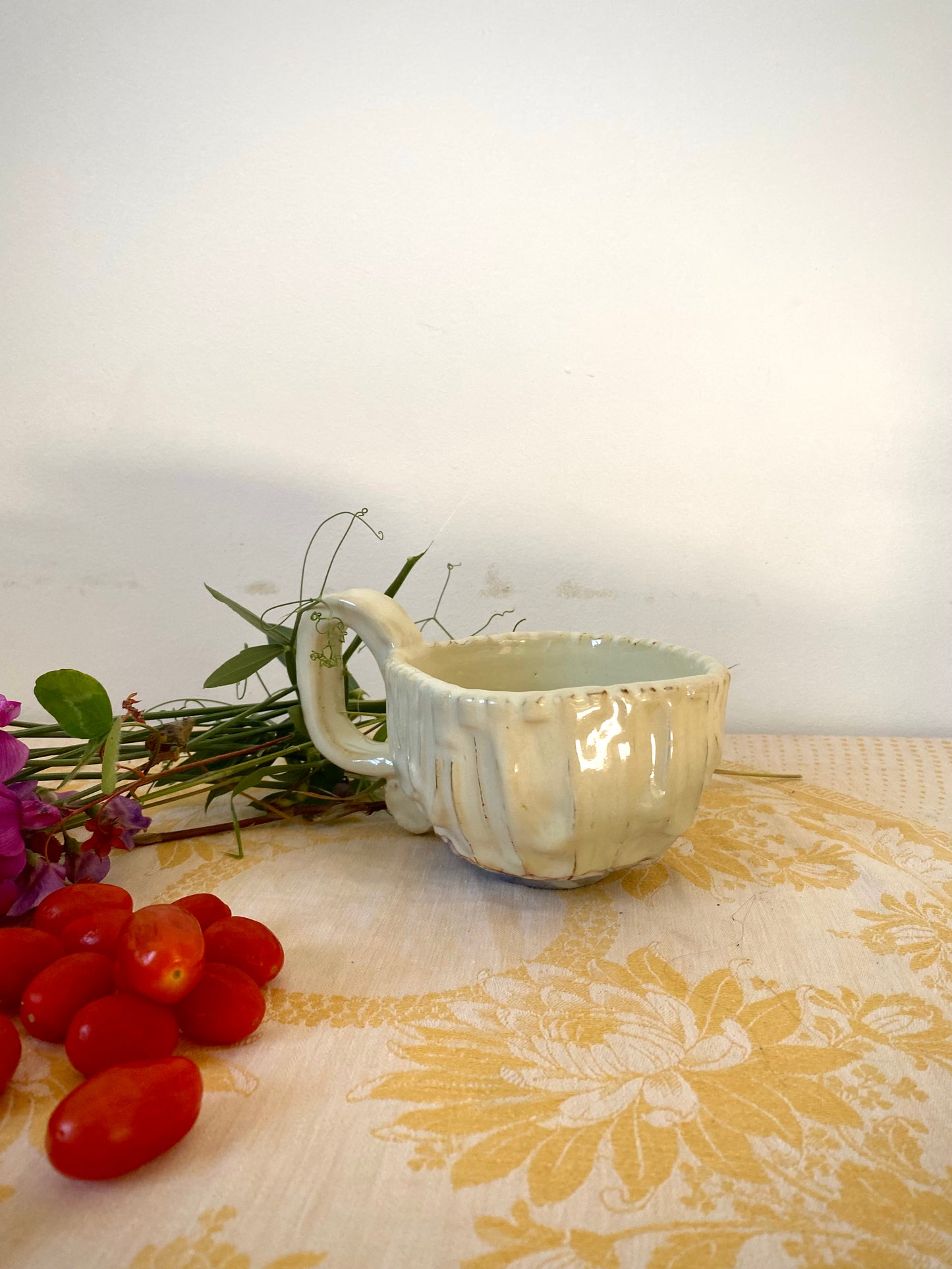 Cream colored mug with squared shape