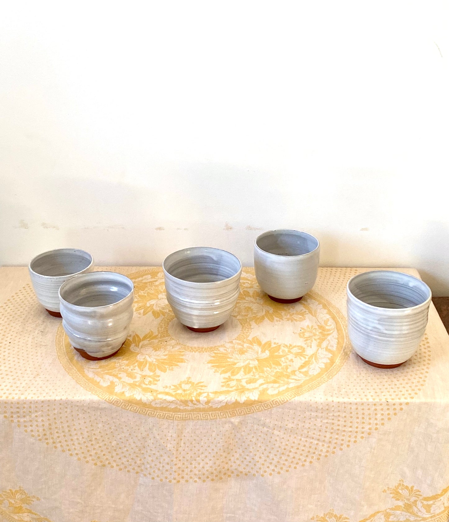 Set of terracotta and white vessels