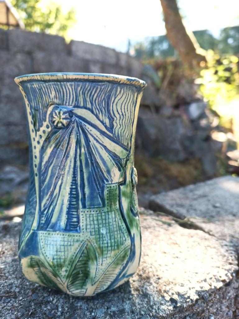 Green vase with blue carving