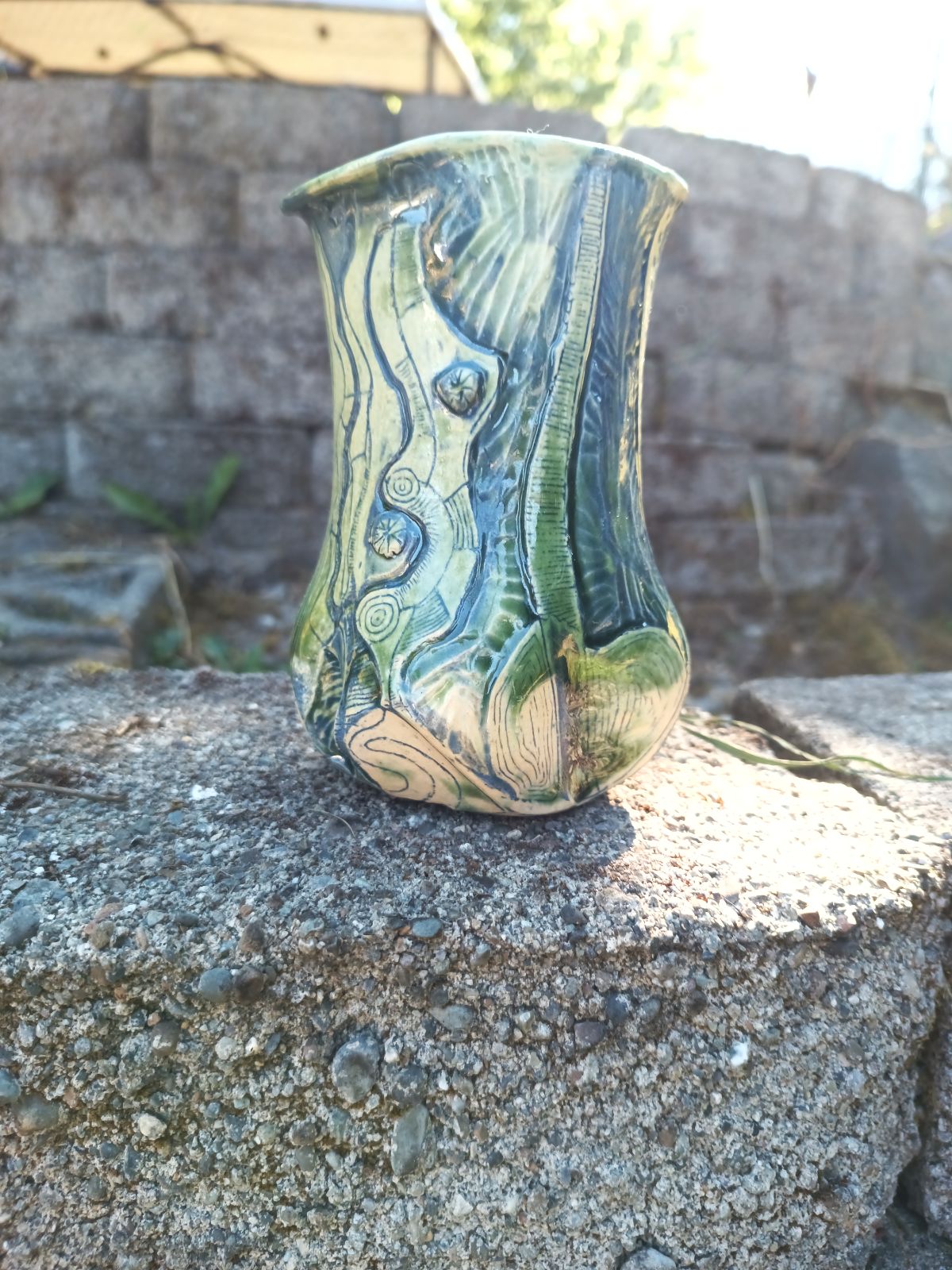 Green vase with blue carving