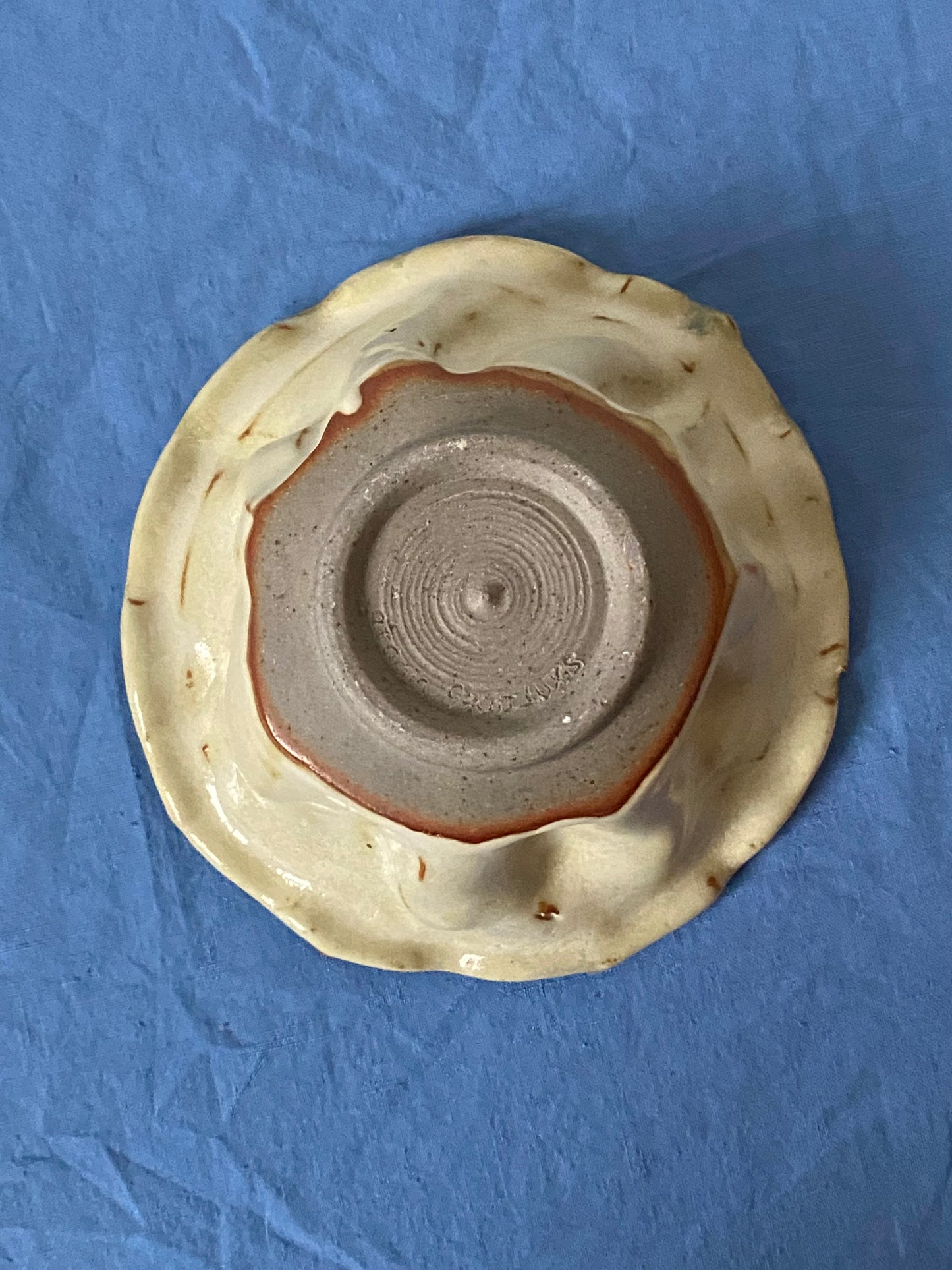 Ruffled bowl with green interior