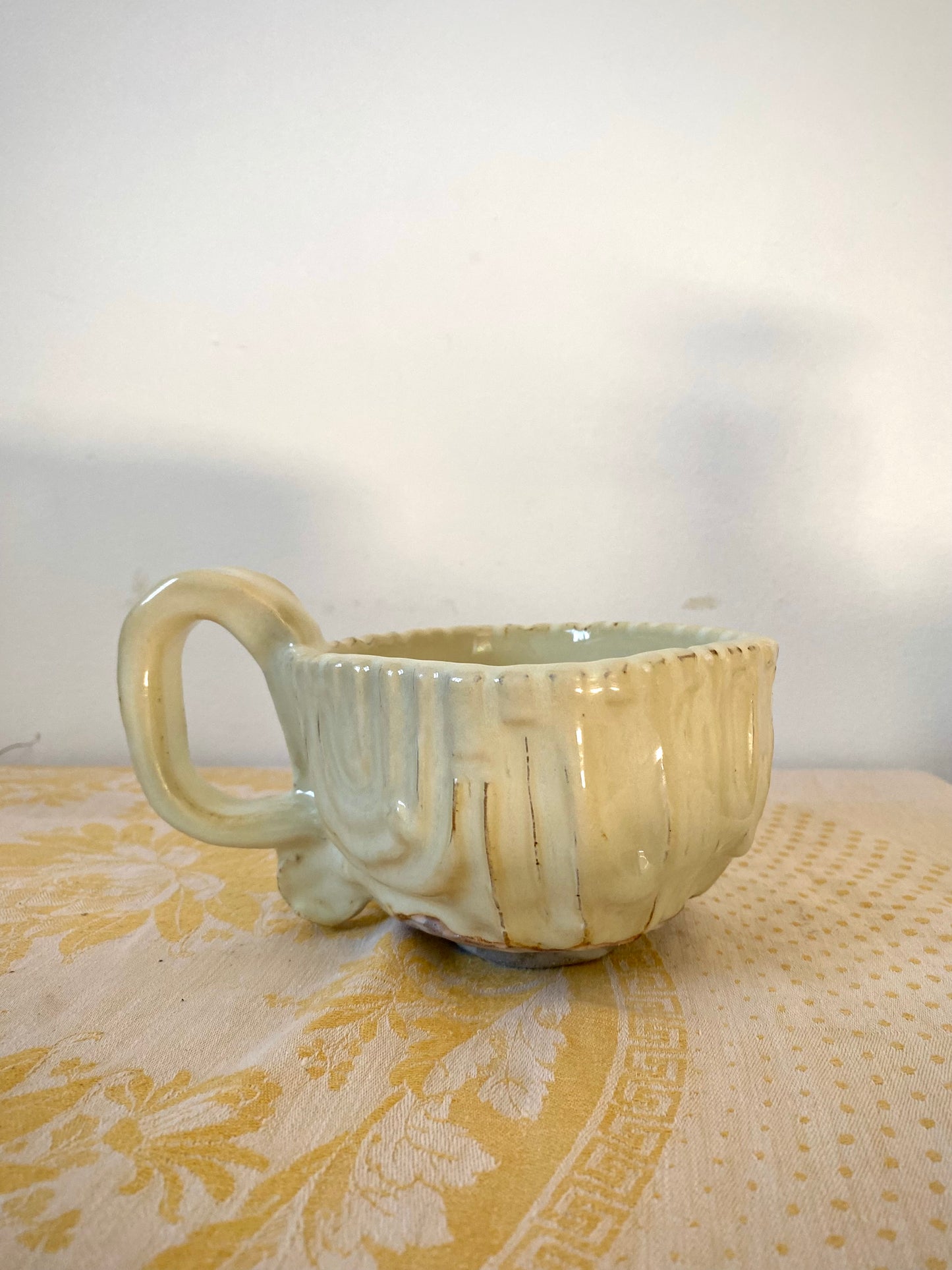 Cream colored mug with squared shape