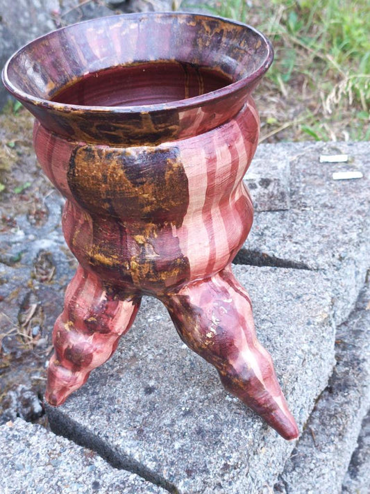 Tripod reddish pot