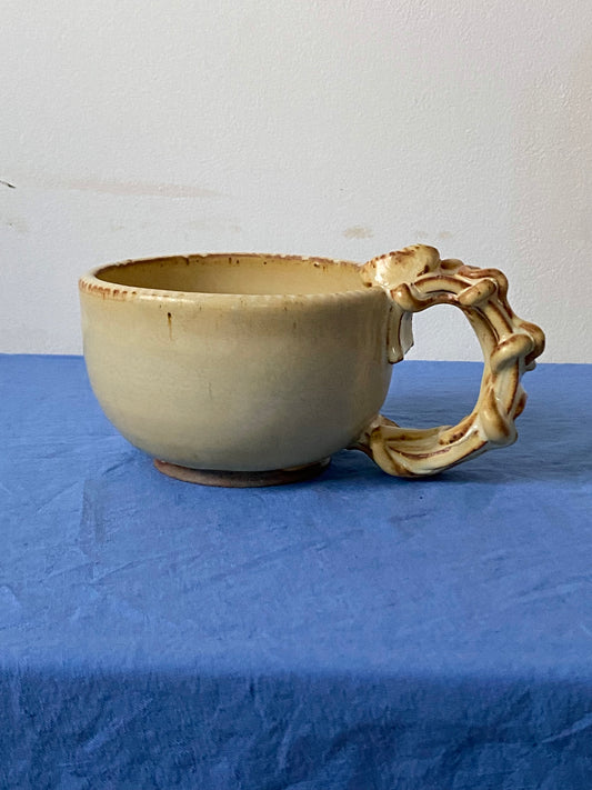 Yellow cream mug with coily handle