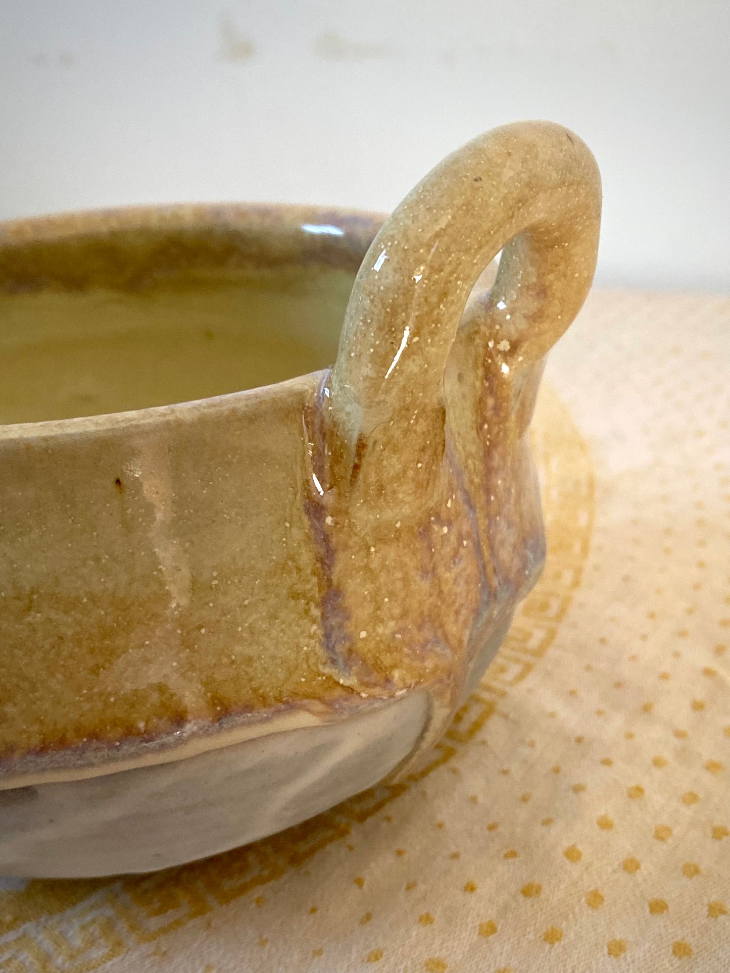 Small cream colored bowl with violet drips