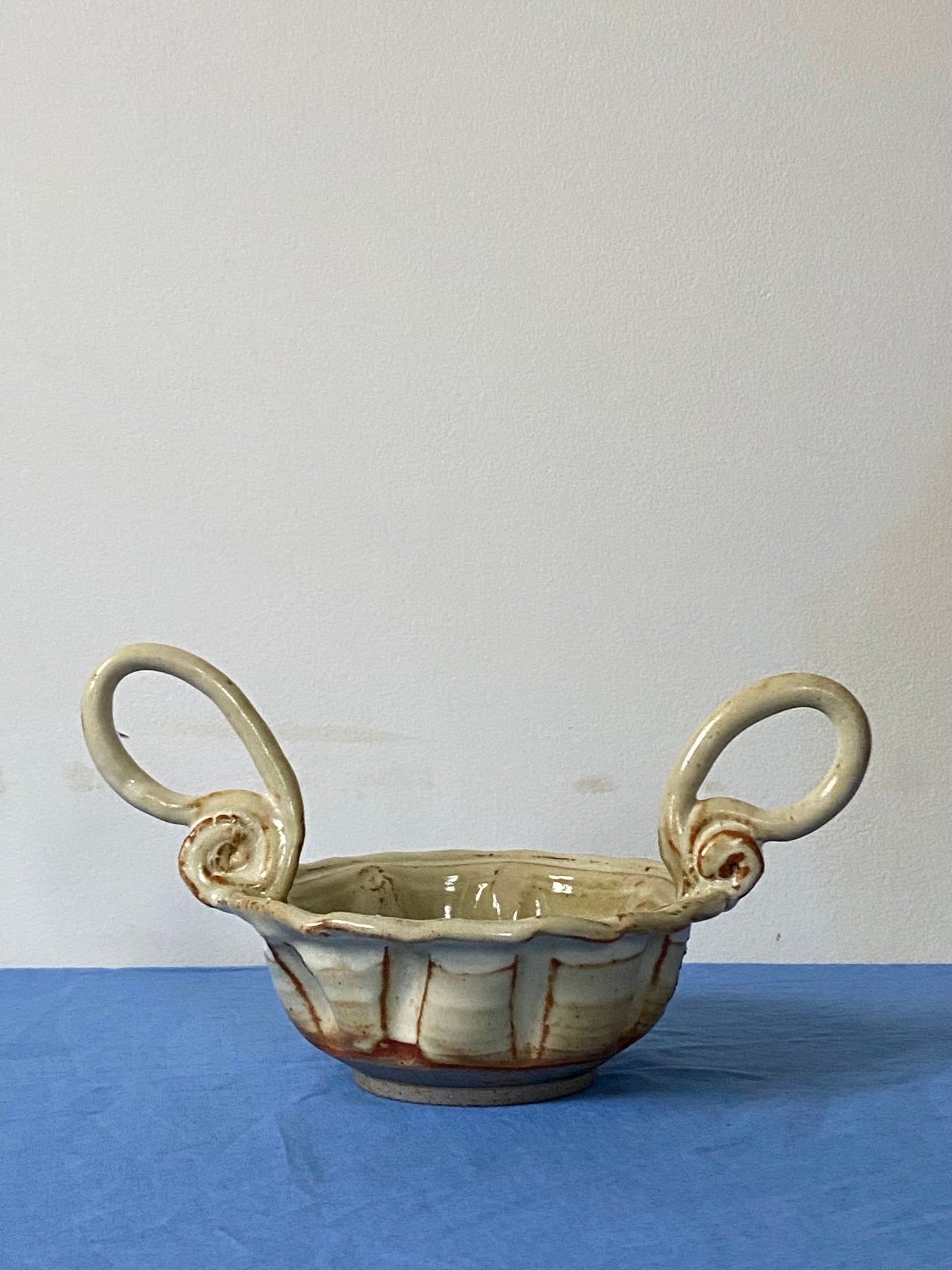 Cream bowl with stirrup handles
