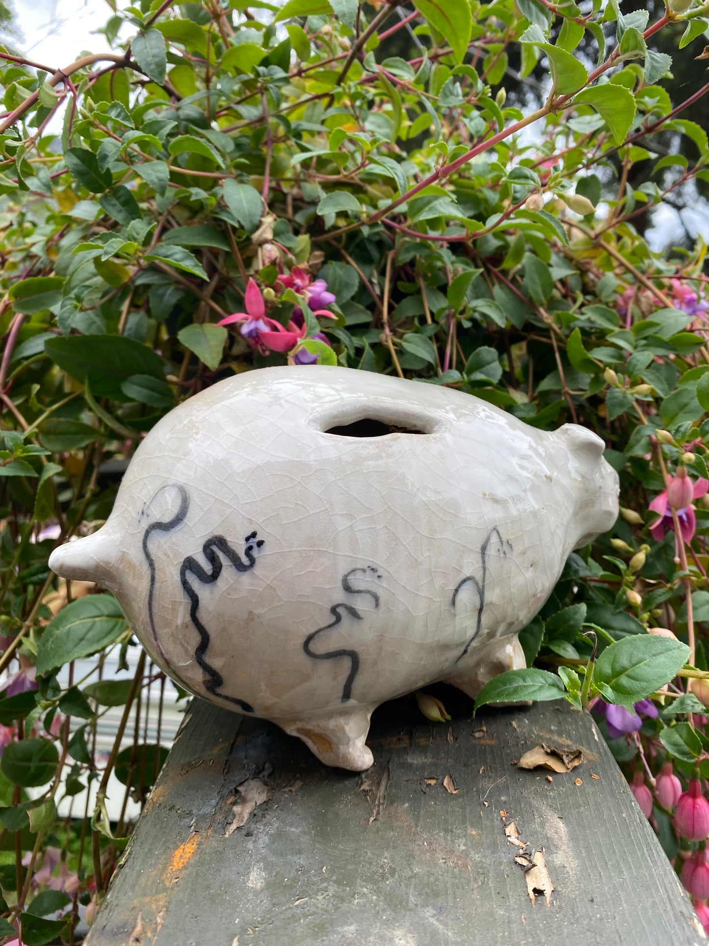 Beast piggy bank with vines