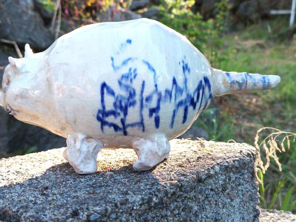 Beast piggy bank with blue fence