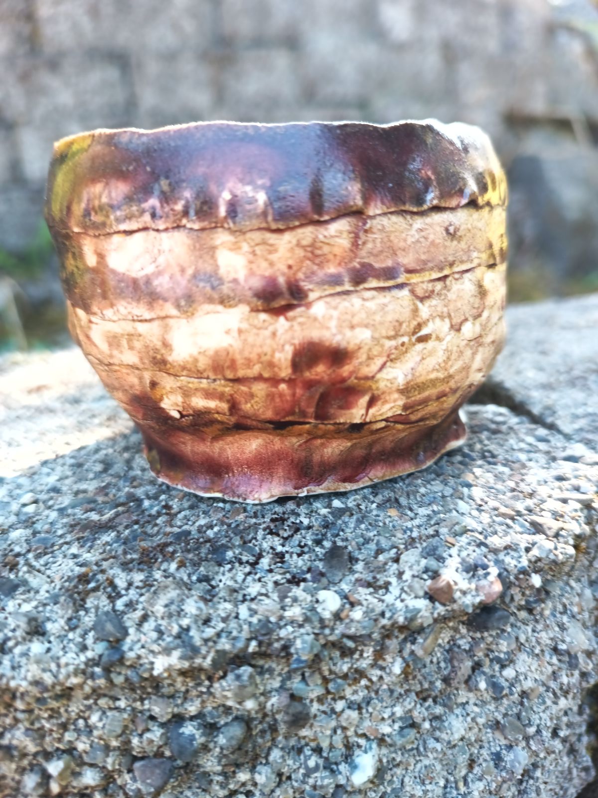 Handbuilt amber/mauve porcelain cup