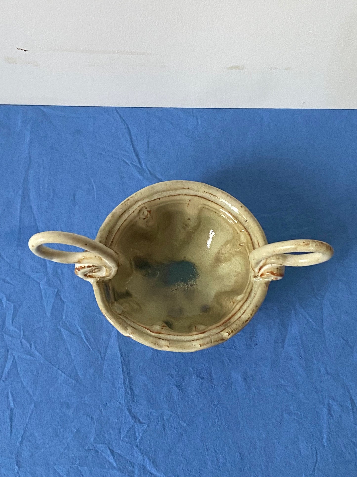 Cream bowl with stirrup handles