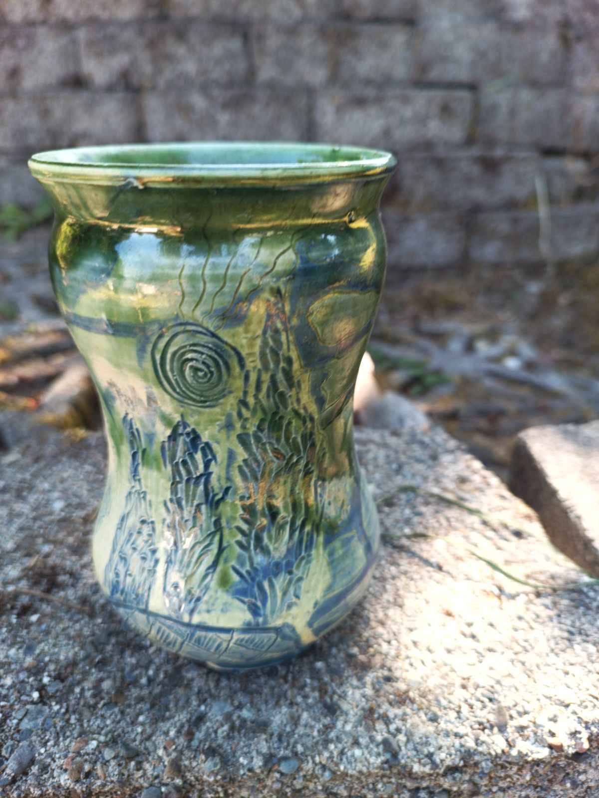 Green vase with blue carving & palm tree