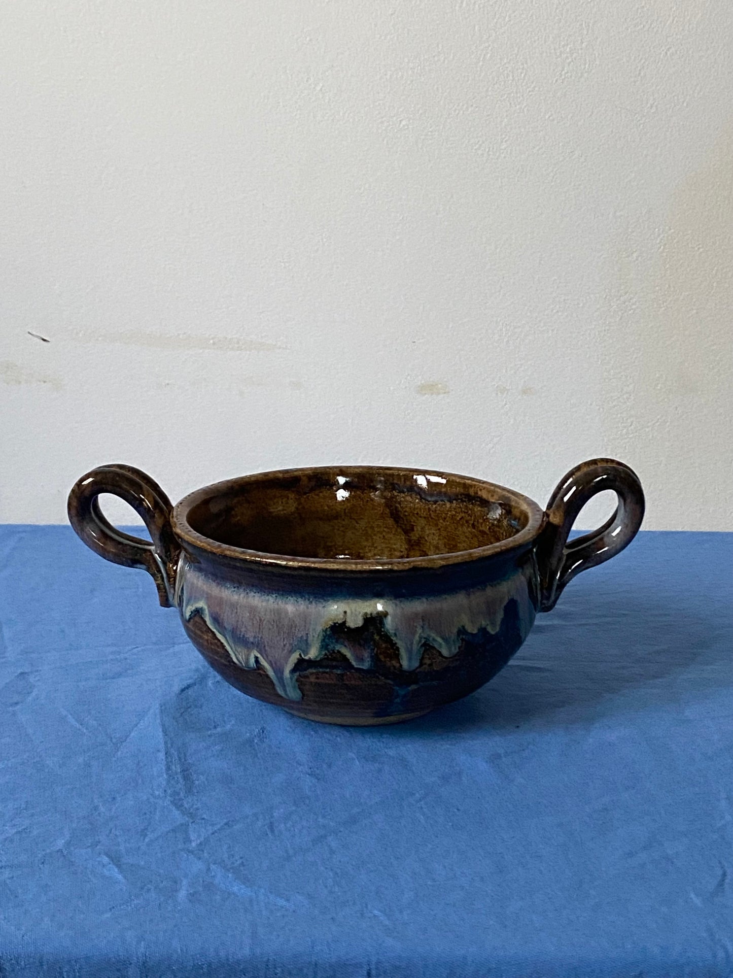 Black two handled bowl violet drips
