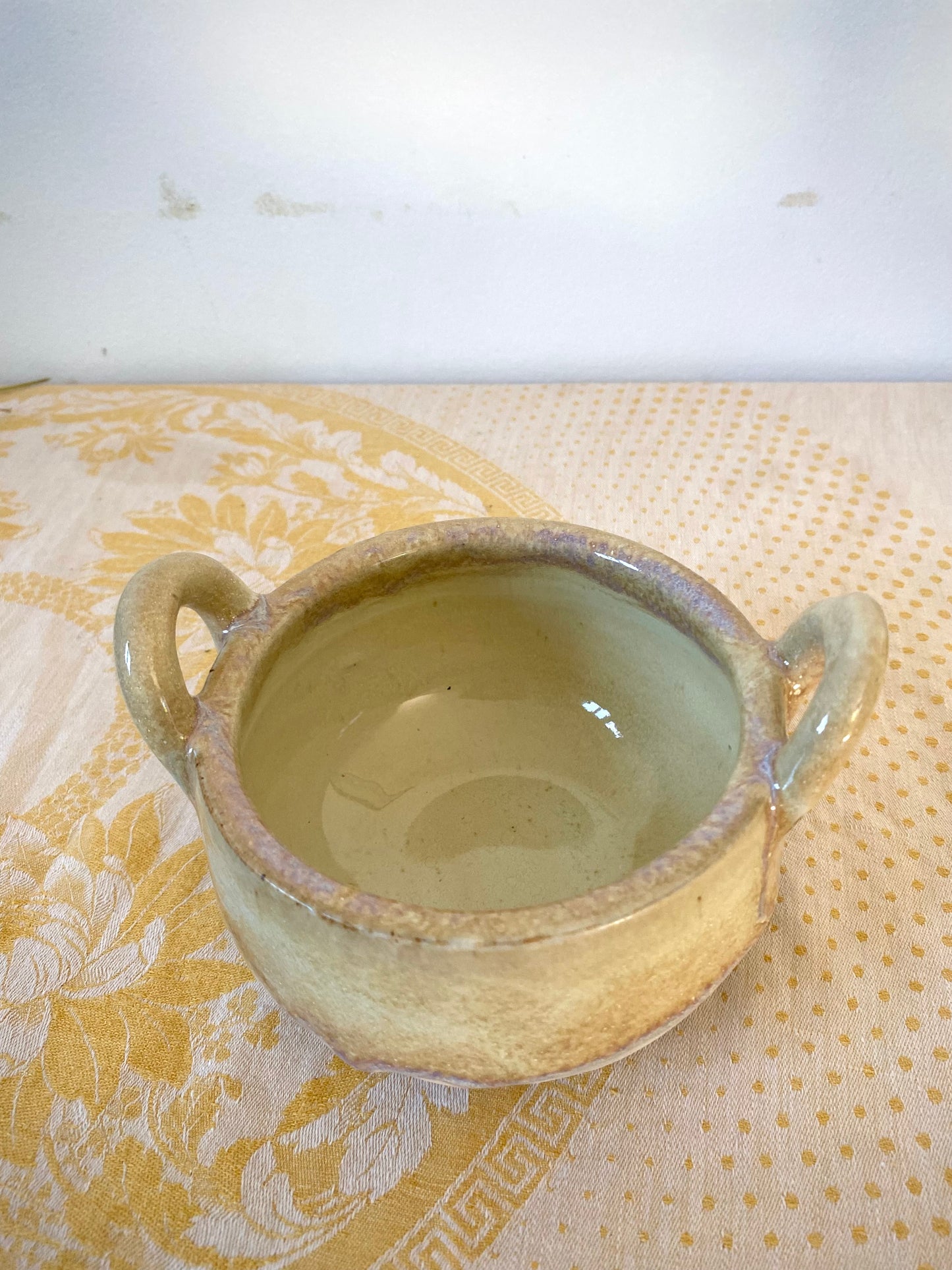 Small cream colored bowl with violet drips