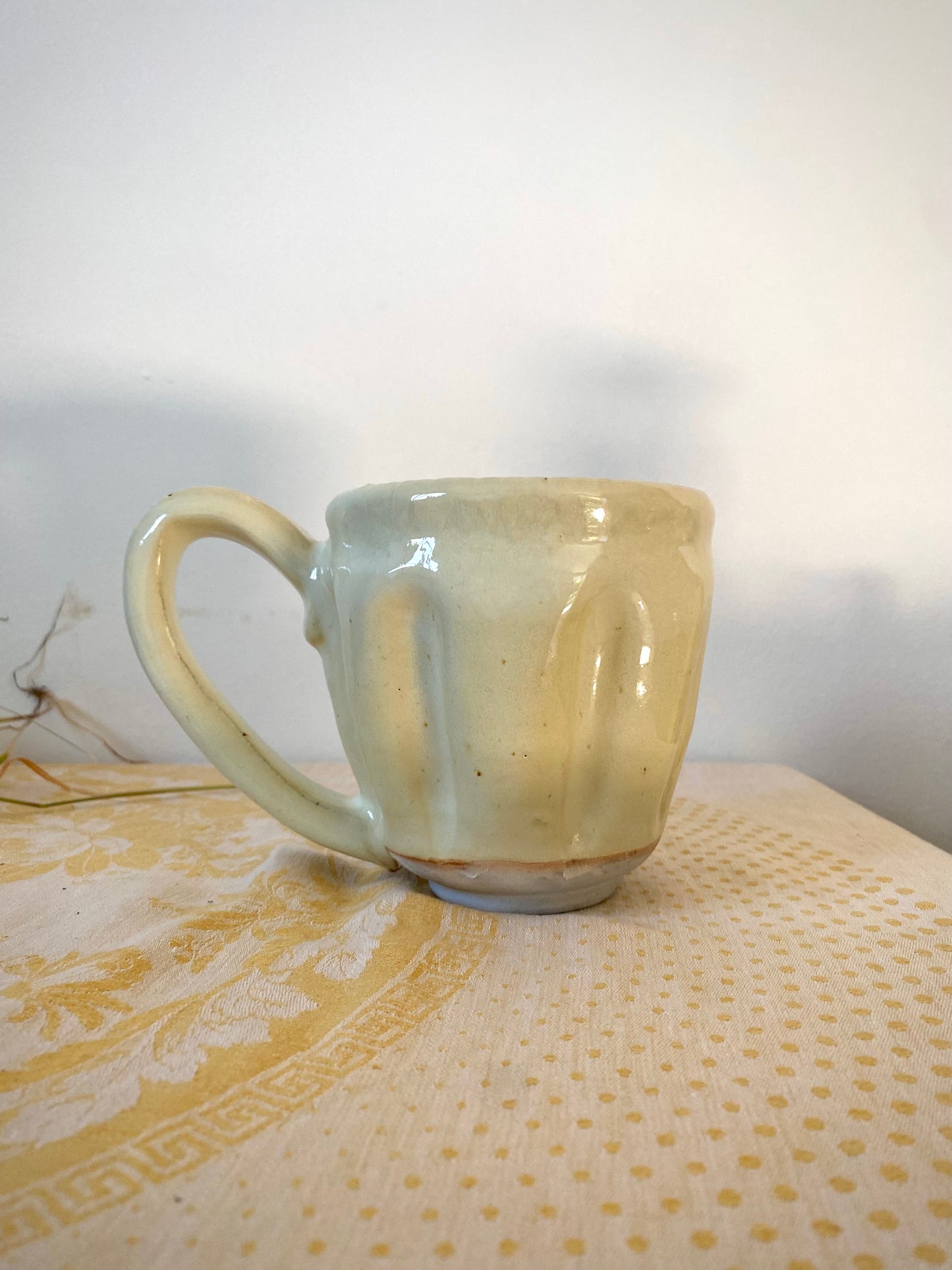 Cream colored mug with big ol’ handle