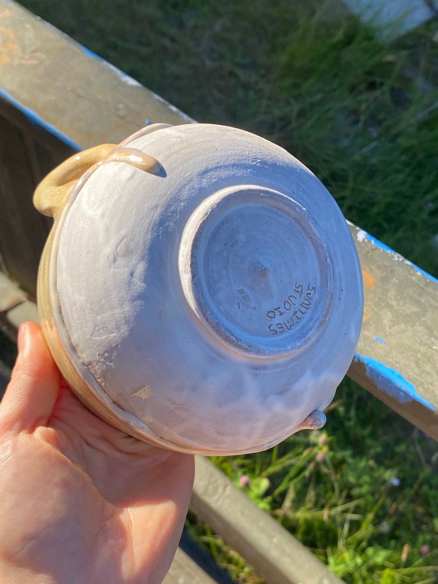 Small cream colored bowl with violet drips