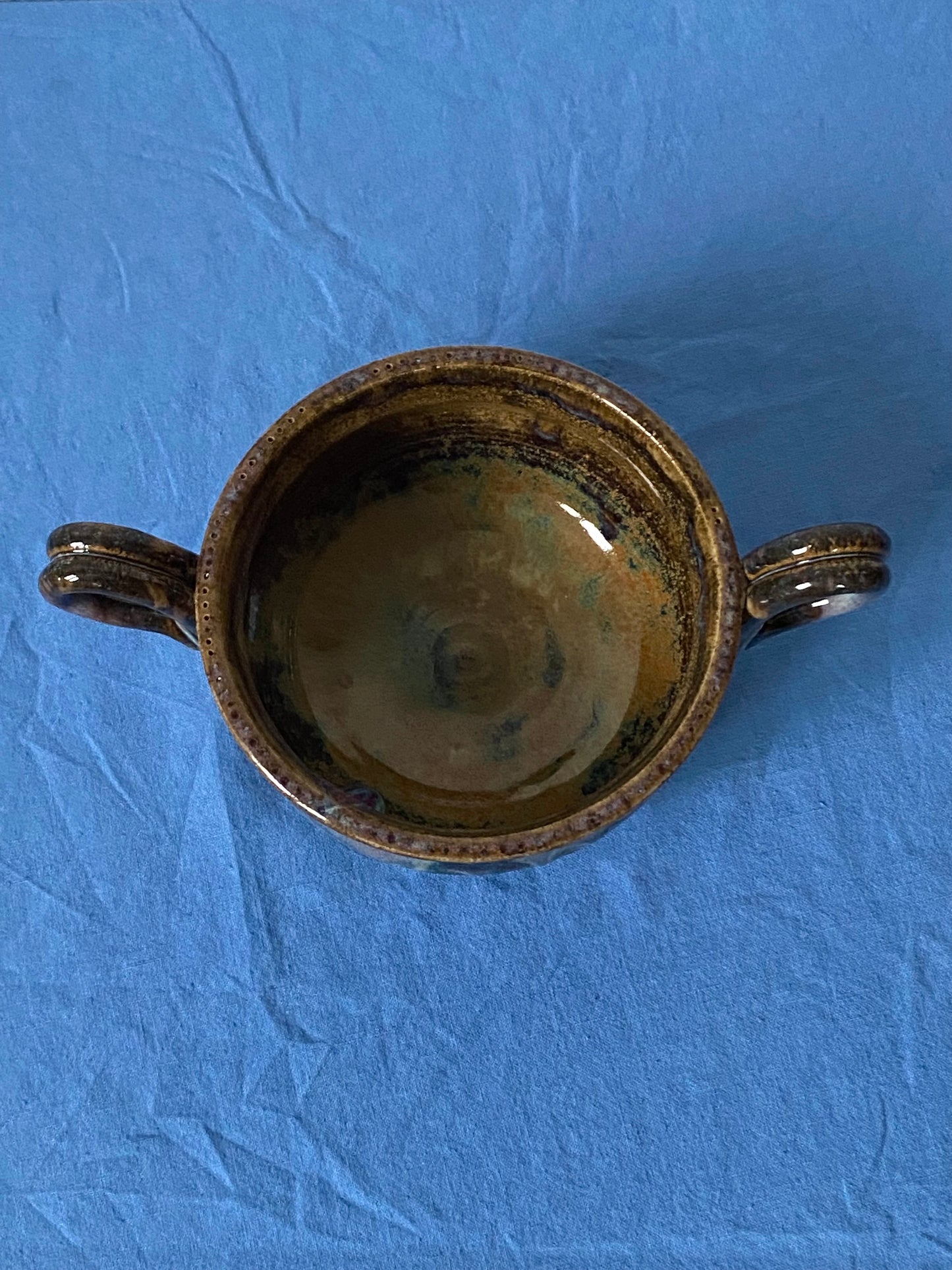 Black two handled bowl violet drips