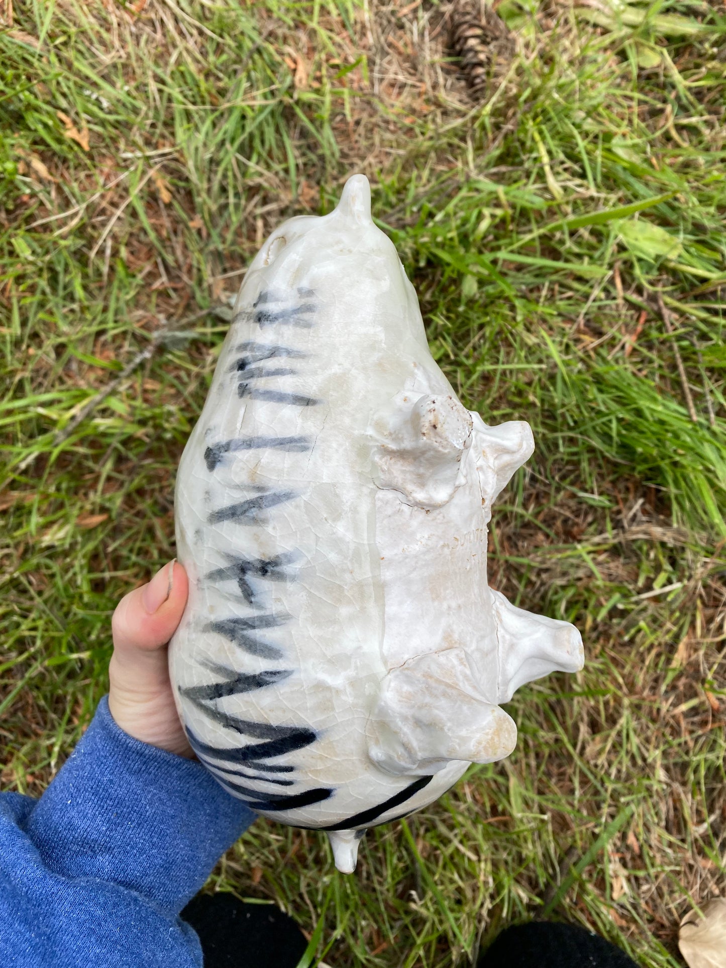 Beast piggy bank with grass