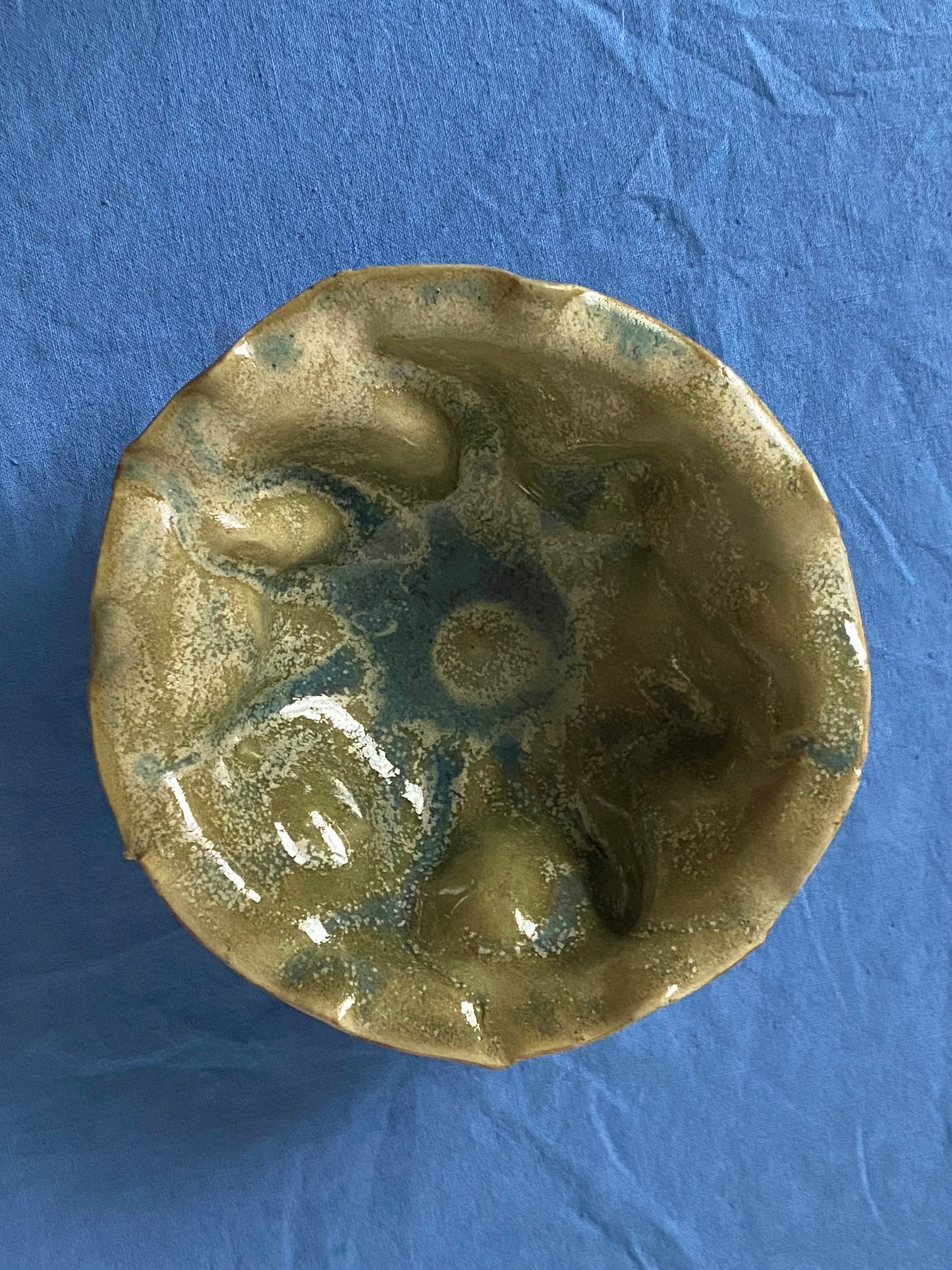 Ruffled bowl with green interior