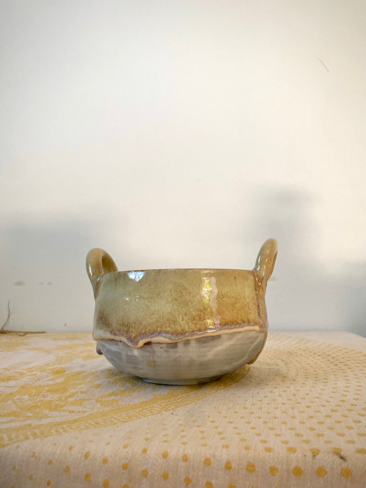Small cream colored bowl with violet drips