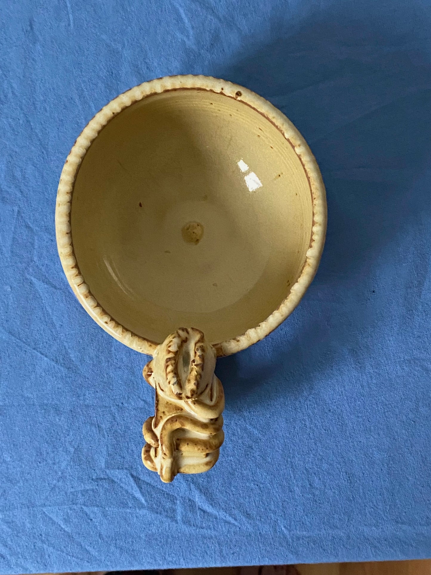 Yellow cream mug with coily handle