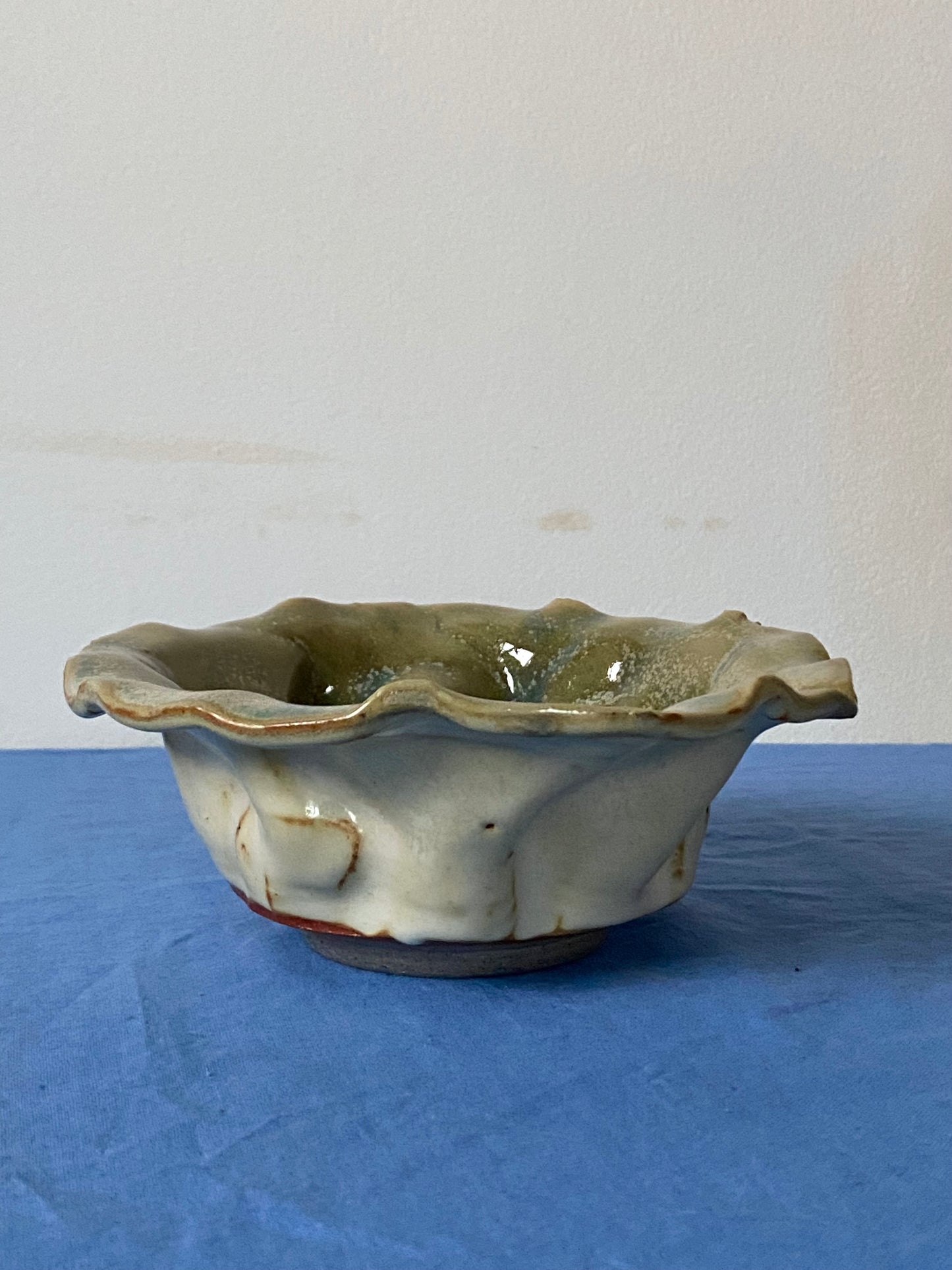 Ruffled bowl with green interior
