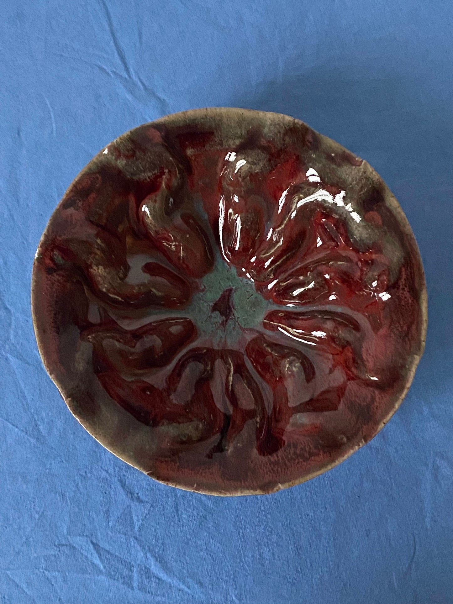 Ruffled bowl with red interior